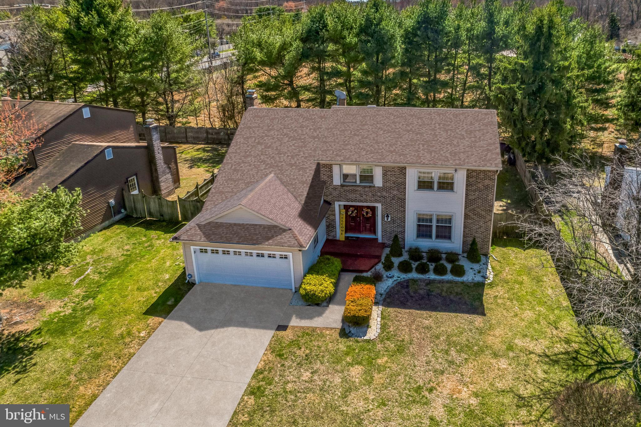 a aerial view of a house with swimming pool