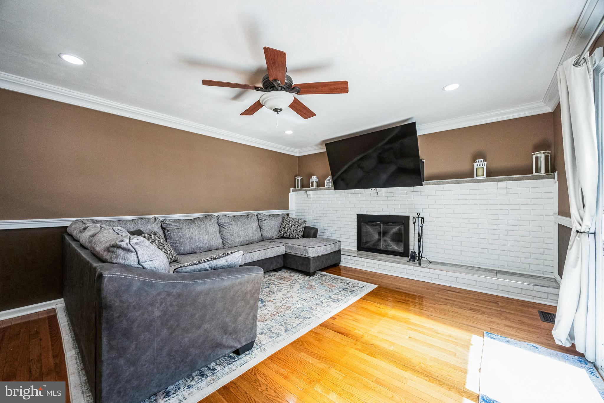 2016 Morris Drive Cherry Hill, NJ 08003 - Photo 11 of 31 a living room with furniture and a fireplace