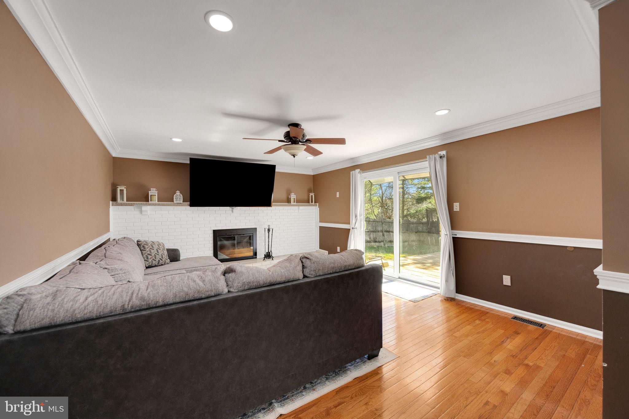 2016 Morris Drive Cherry Hill, NJ 08003 - Photo 12 of 31 a living room with furniture and a flat screen tv