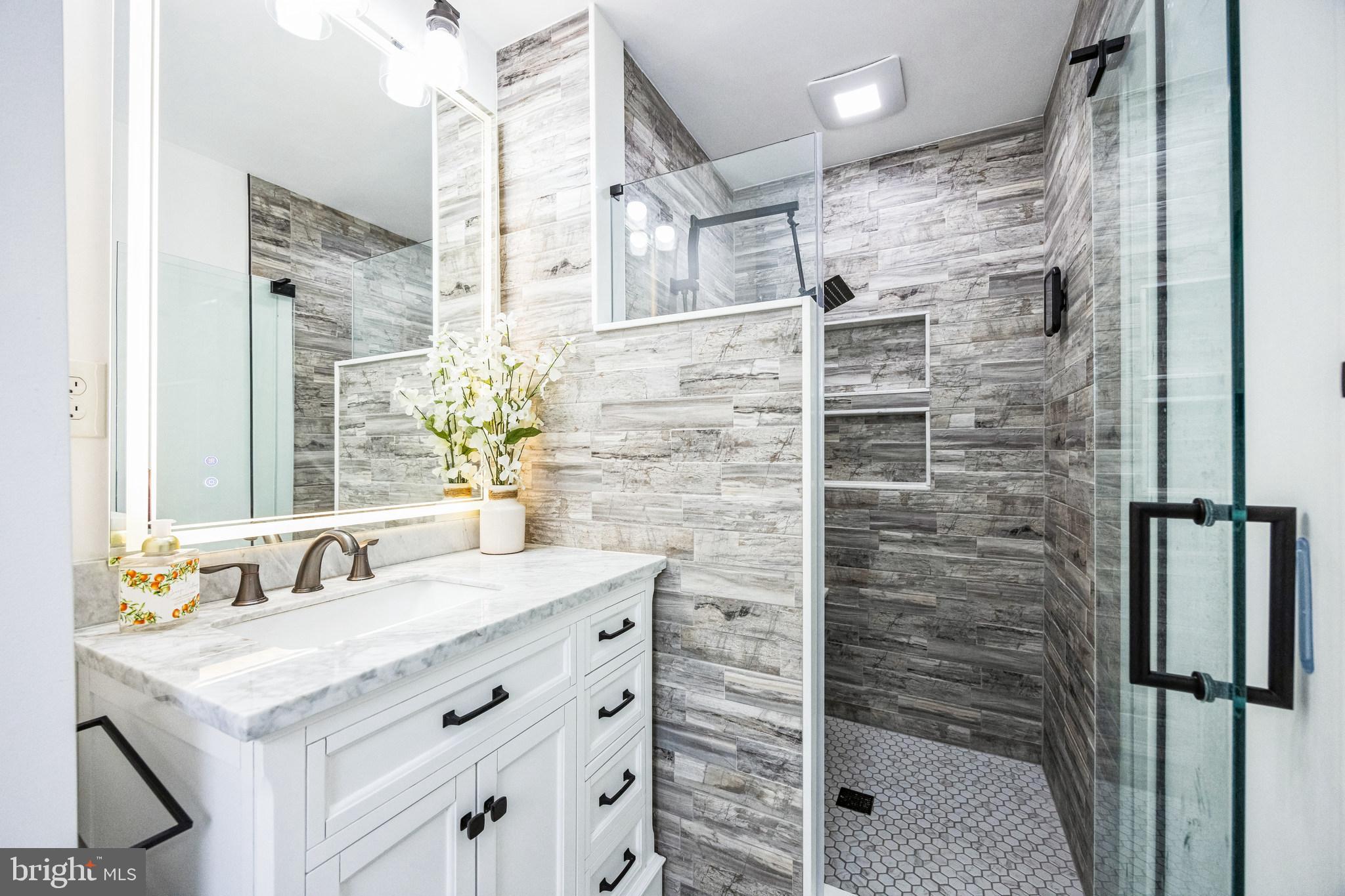 2016 Morris Drive Cherry Hill, NJ 08003 - Photo 15 of 31 a bathroom with a shower sink and mirror
