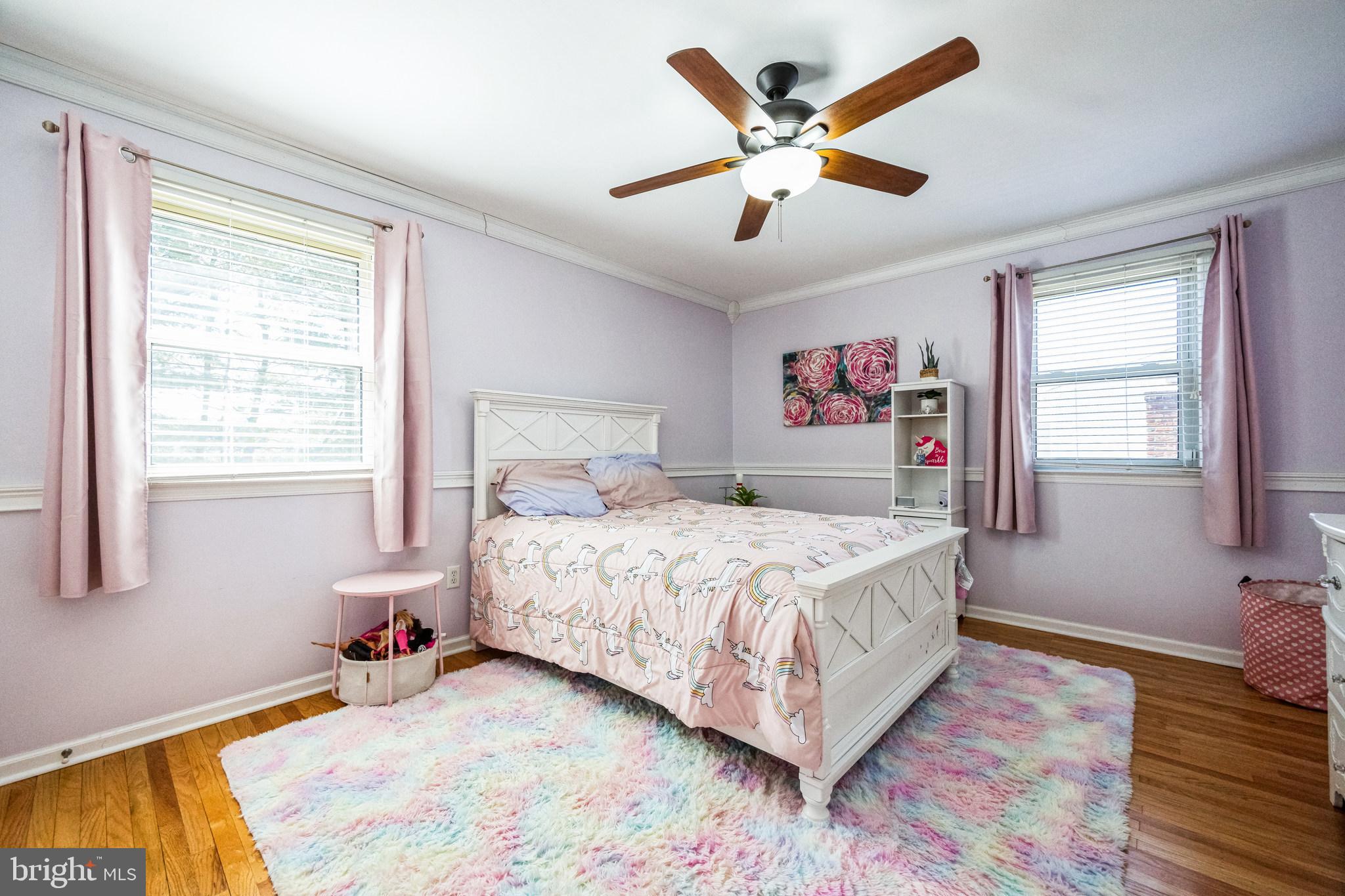 2016 Morris Drive Cherry Hill, NJ 08003 - Photo 17 of 31 a bedroom with a large bed chandelier and a window