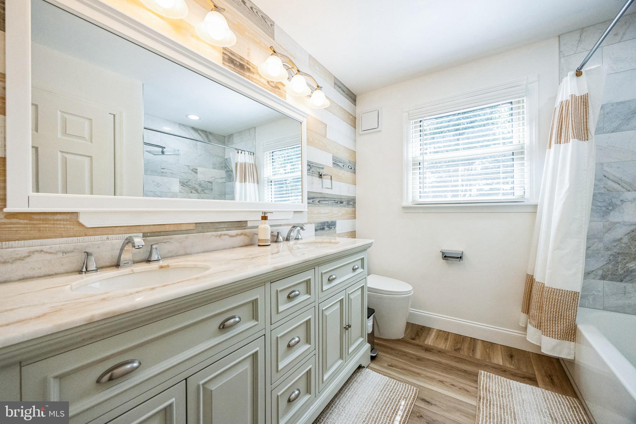 2016 Morris Drive Cherry Hill, NJ 08003 - Photo 19 of 31 a spacious bathroom with a granite countertop sink a toilet and a mirror