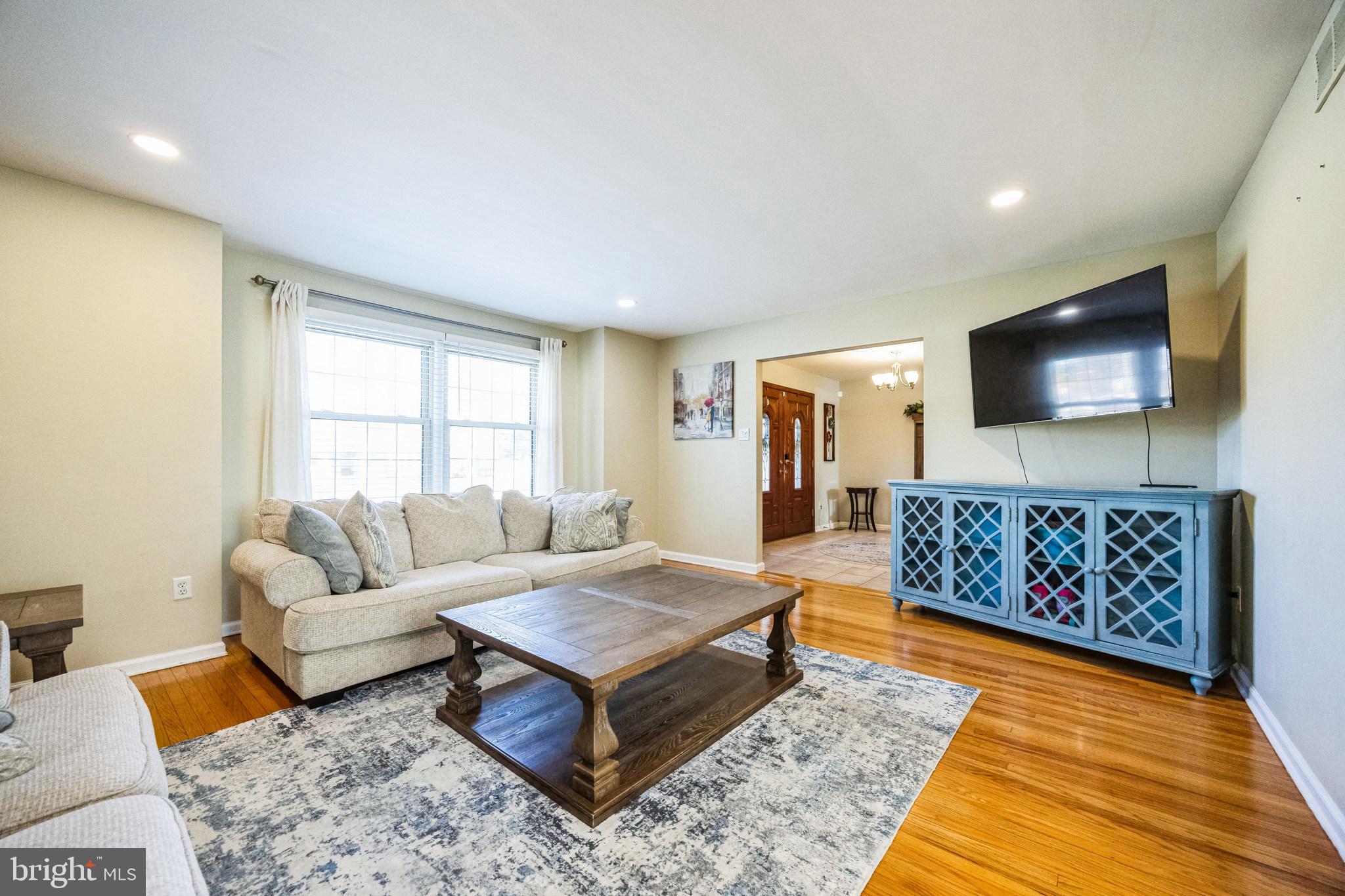 2016 Morris Drive Cherry Hill, NJ 08003 - Photo 4 of 31 a living room with furniture rug and a flat screen tv