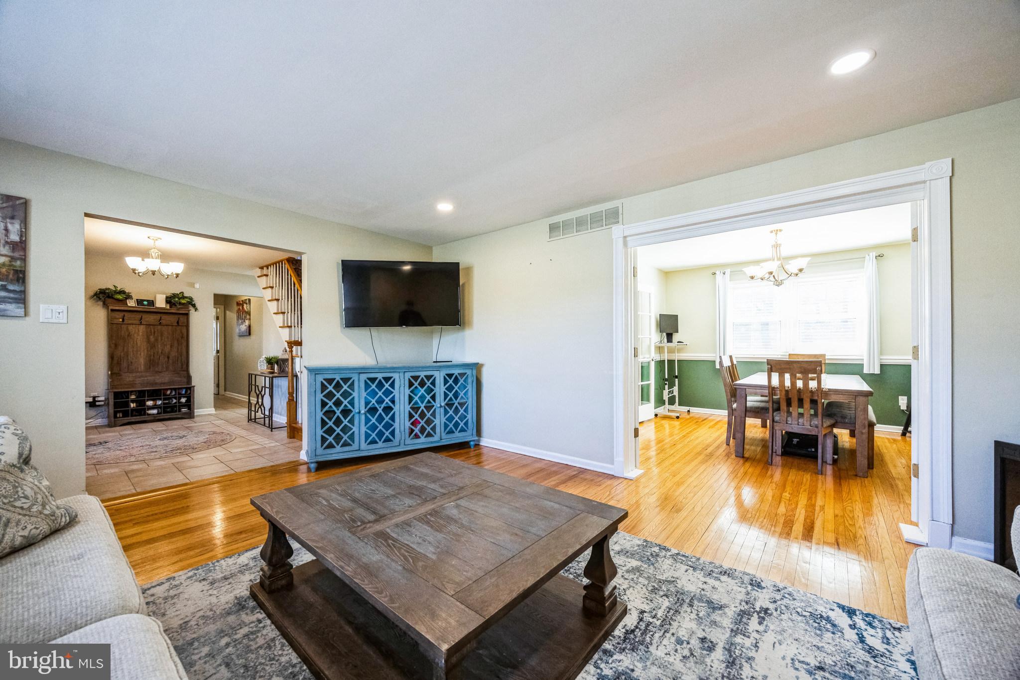 2016 Morris Drive Cherry Hill, NJ 08003 - Photo 5 of 31 a living room with furniture a flat screen tv and a large window