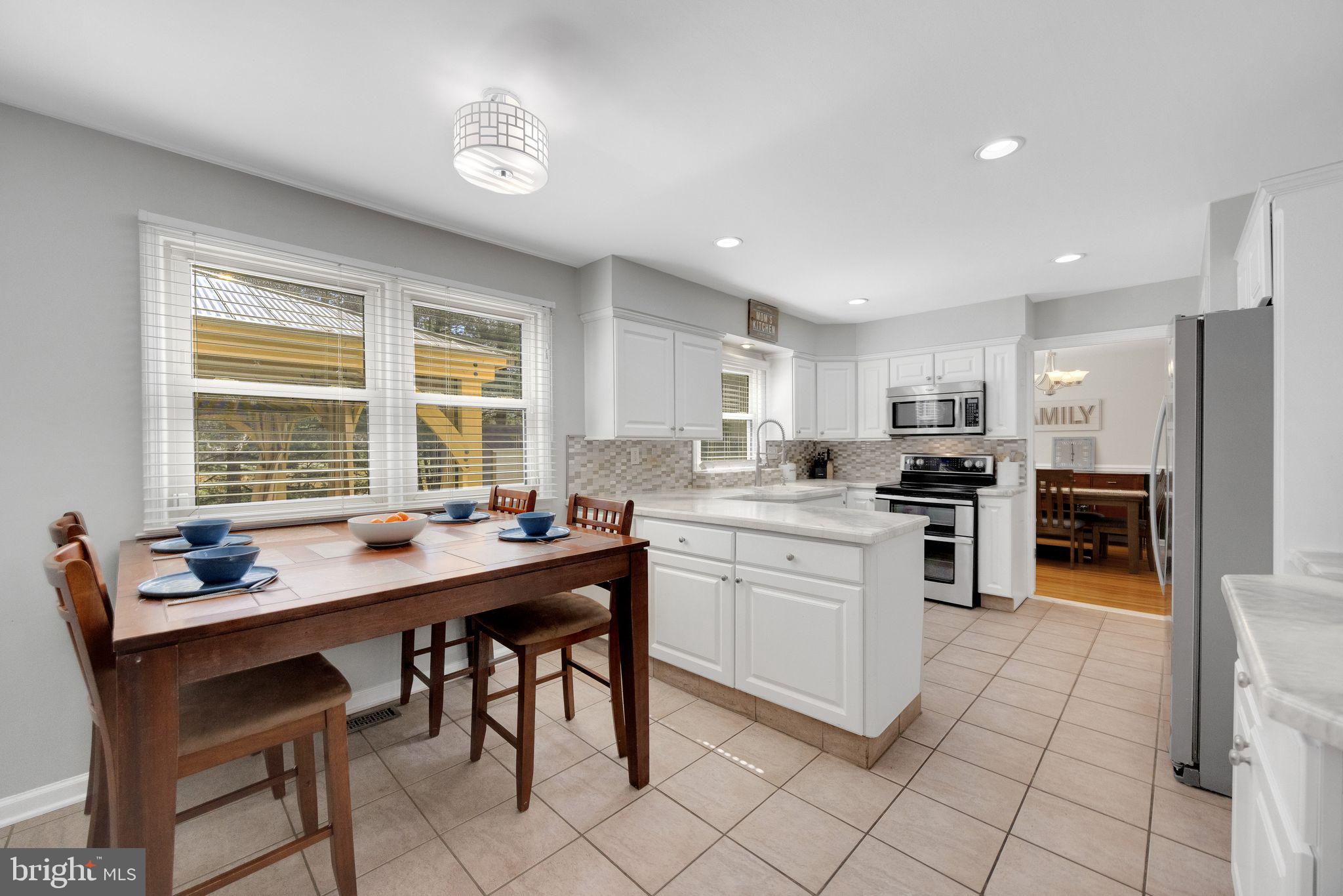 2016 Morris Drive Cherry Hill, NJ 08003 - Photo 8 of 31 a kitchen with stainless steel appliances kitchen island granite countertop a sink and cabinets