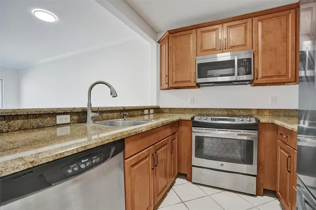 a bedroom with a large bed and a flat screen tv