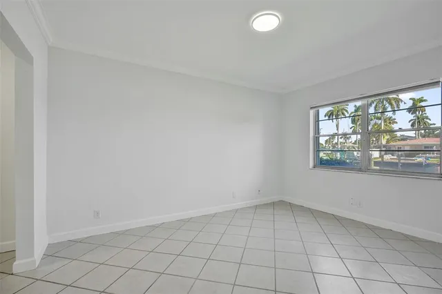 a spacious bathroom with a granite countertop toilet a sink and a mirror