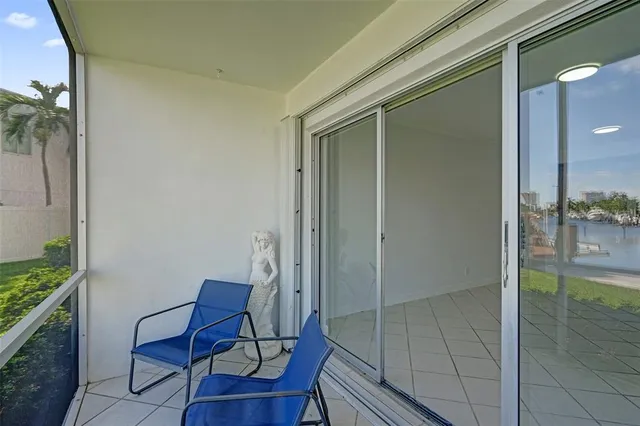 a view of a swimming pool with a patio and a garden