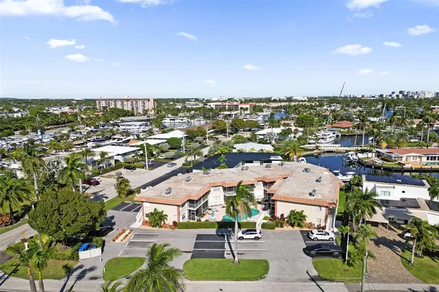 a view of a street with a house in the background