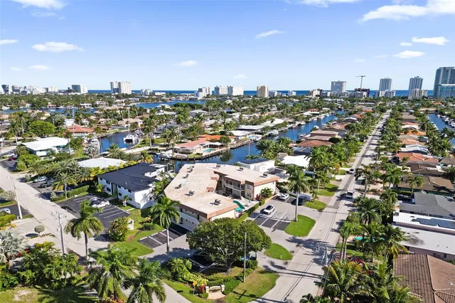 a view of a kitchen with a sink and chandelier