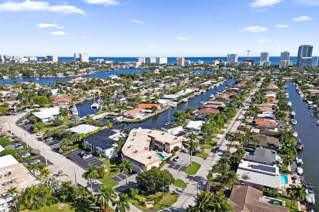 a kitchen with a sink and a wooden floor