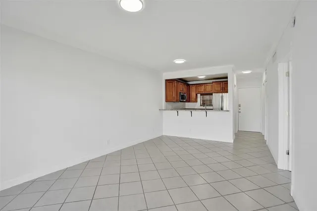 a kitchen with granite countertop a sink and a stove top oven