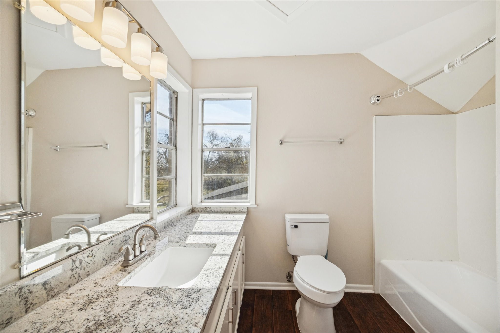 14311 Blidel Road Thompsons, TX 77469 - Photo 15 of 27 Full bathroom featuring granite countertop vanity, wall mirror, overhead lighting, tub/shower combination, and natural light from window.