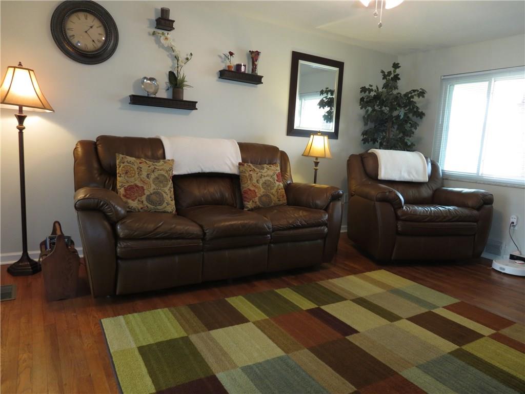 33 Highbury Road Cheswick, PA 15024 - Photo 2 of 17 The living room is warm and inviting with hard wood floors, lots of natural light and neutral paint.