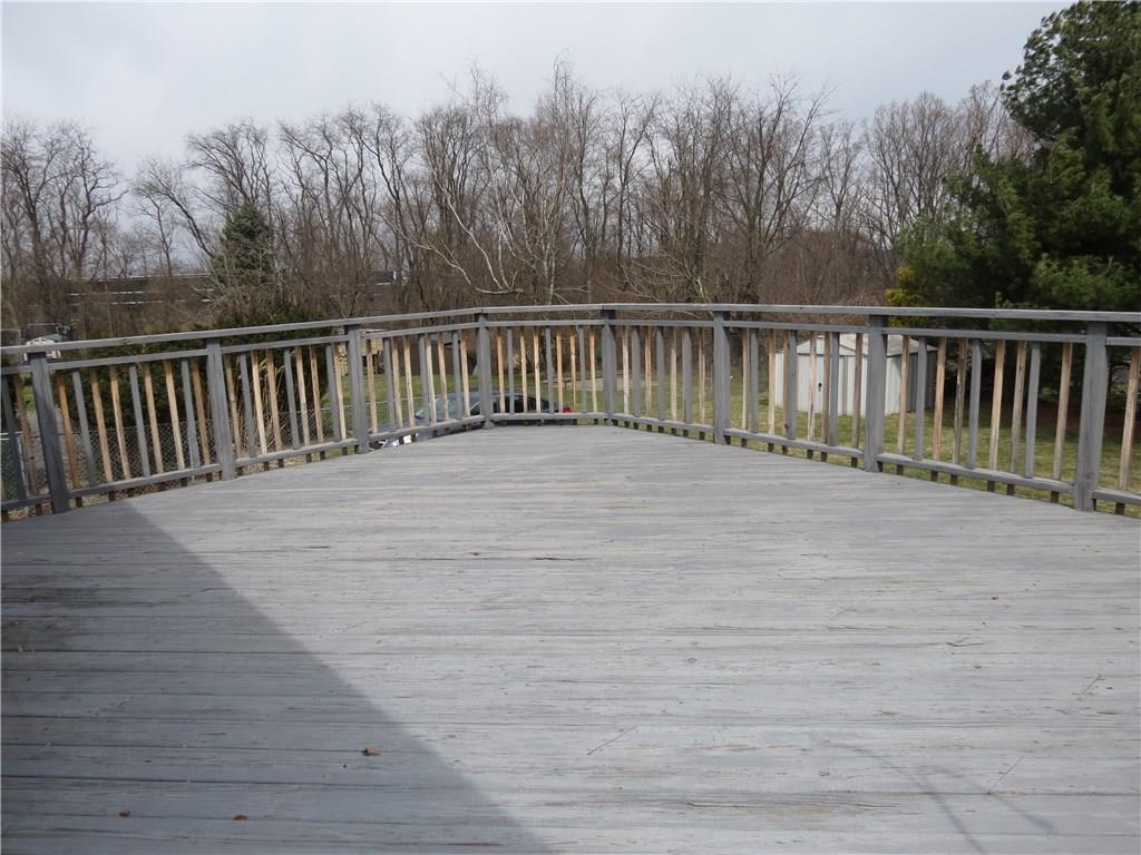33 Highbury Road Cheswick, PA 15024 - Photo 16 of 17 Wow! What a deck! This home is located in a quiet neighborhood and the backyard feels remote and private.