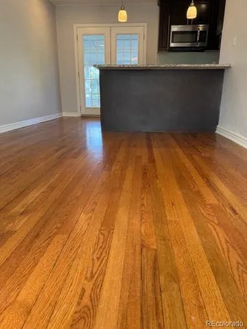 a living room with wooden floor