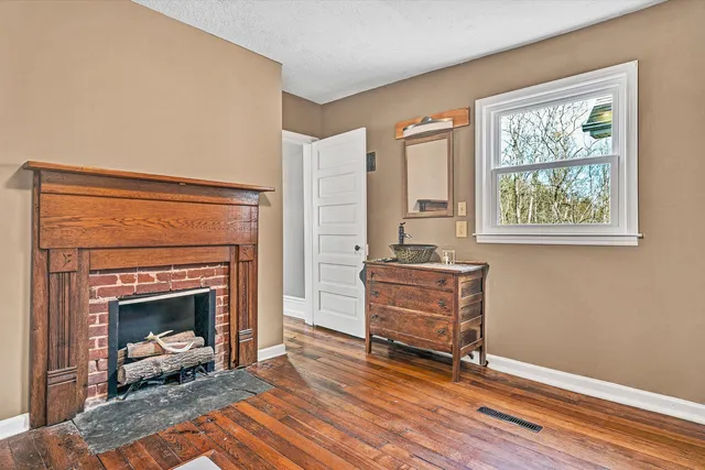 a view of a room with furniture and window