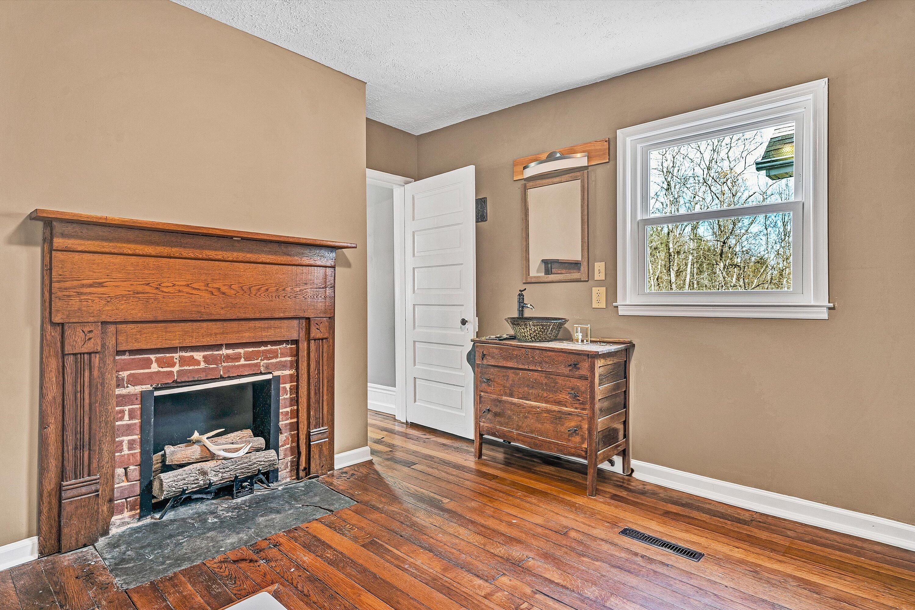 412 Wrays Chapel Road Rocky Mount, VA 24151 - Photo 11 of 25 a living room with furniture and a fireplace