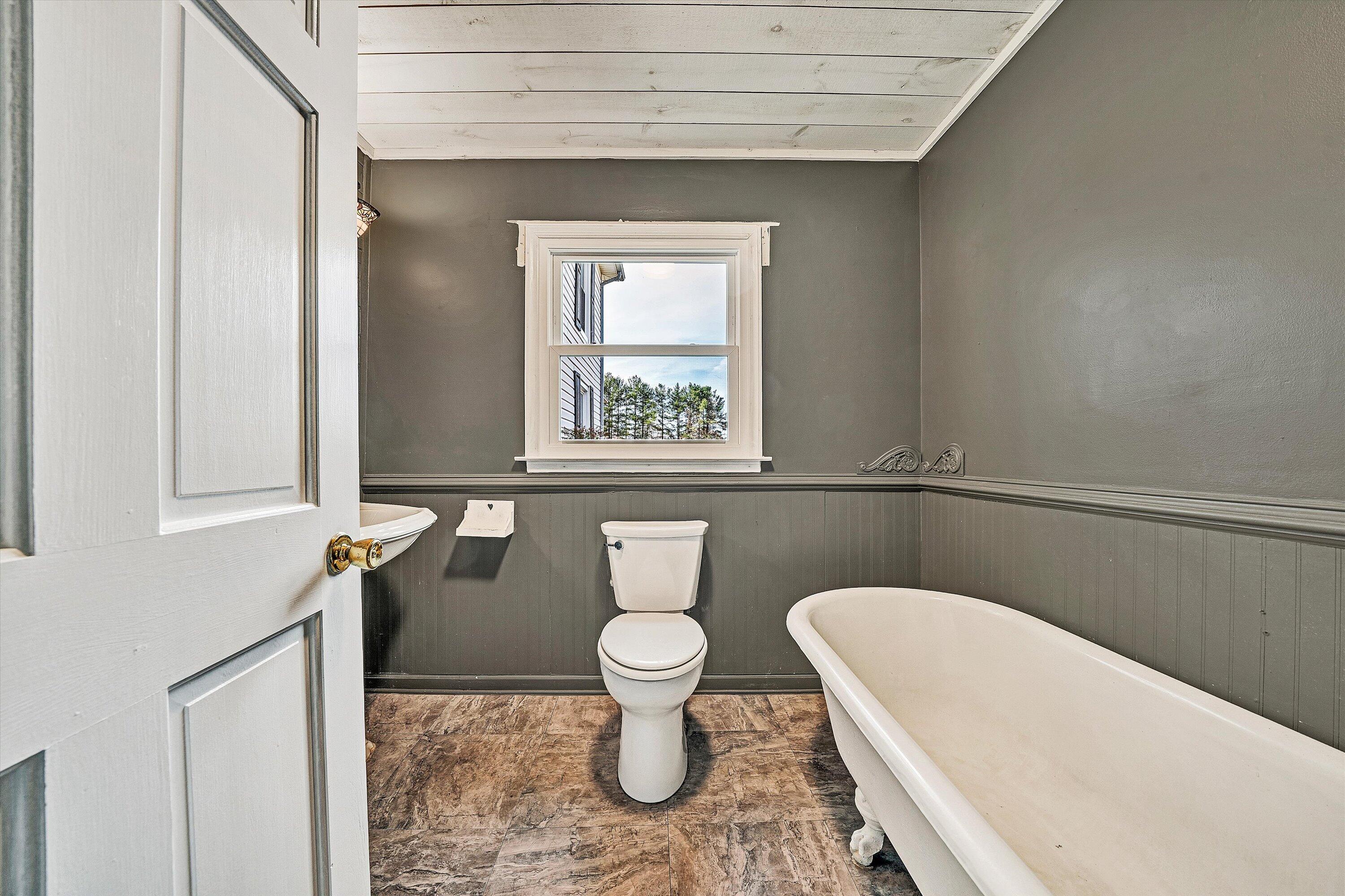 412 Wrays Chapel Road Rocky Mount, VA 24151 - Photo 14 of 25 a bathroom with a toilet and a window