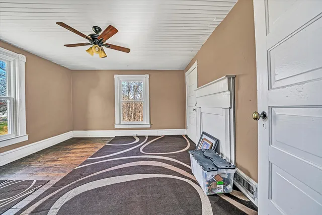 a view of entryway with wooden floor