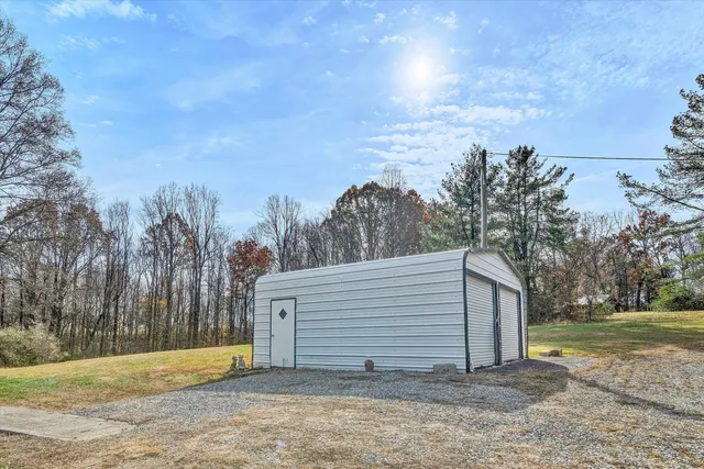 a view of outdoor space with wooden floor and a window