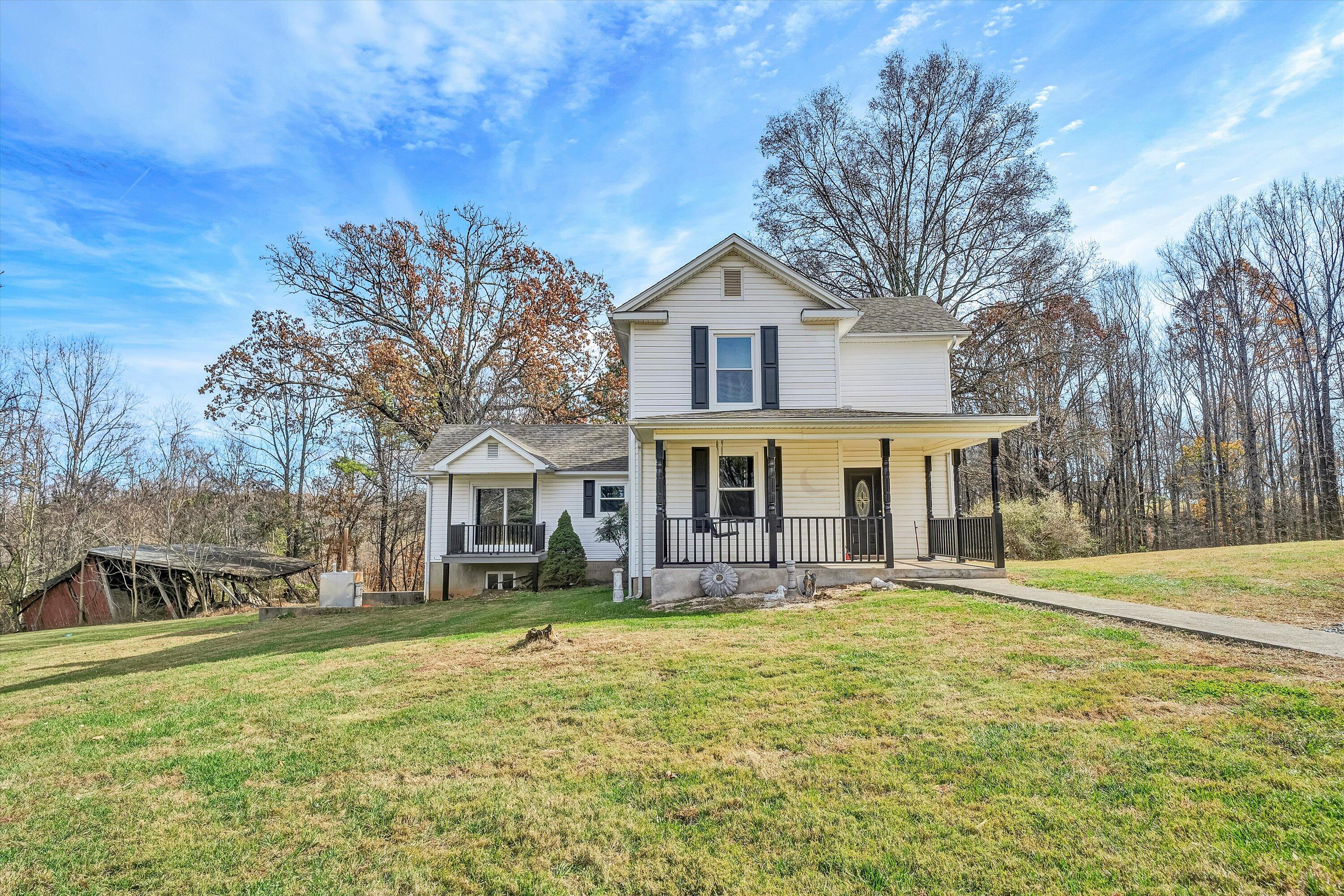 412 Wrays Chapel Road Rocky Mount, VA 24151 - Photo 20 of 25 a front view of a house with a yard
