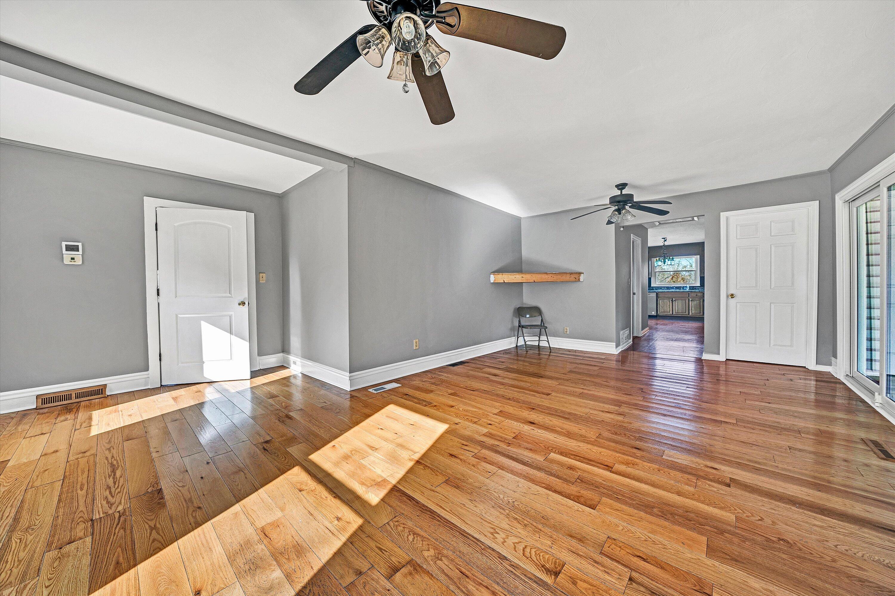 412 Wrays Chapel Road Rocky Mount, VA 24151 - Photo 5 of 25 a bedroom with a bed and a chandelier