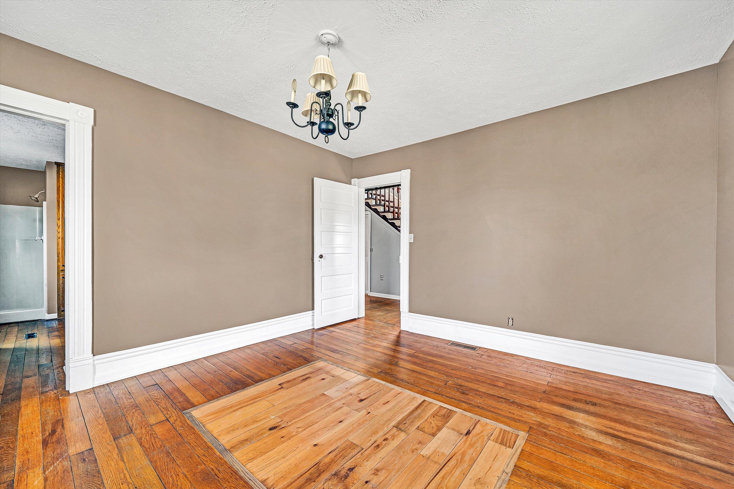 412 Wrays Chapel Road Rocky Mount, VA 24151 - Photo 9 of 25 a view of an empty room with wooden floor