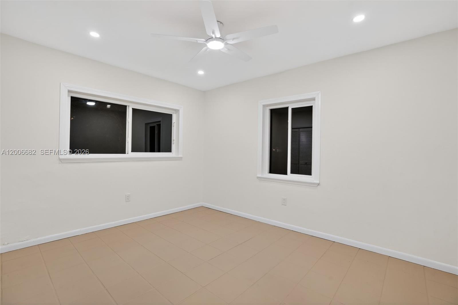 1435 Blue Road Coral Gables, FL 33146 - Photo 21 of 31 an empty room with a empty space and windows