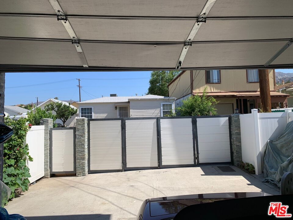 6856 Quinton Lane Tujunga, CA 91042 - Photo 3 of 7 a view of a house with a garage