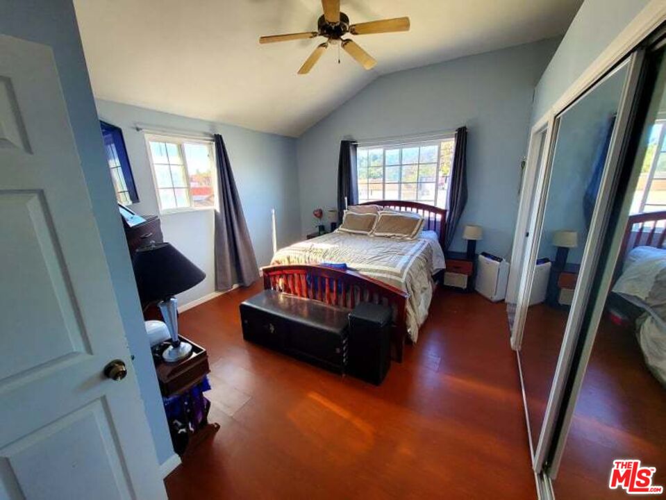 6856 Quinton Lane Tujunga, CA 91042 - Photo 4 of 7 a living room with a bed furniture and a window