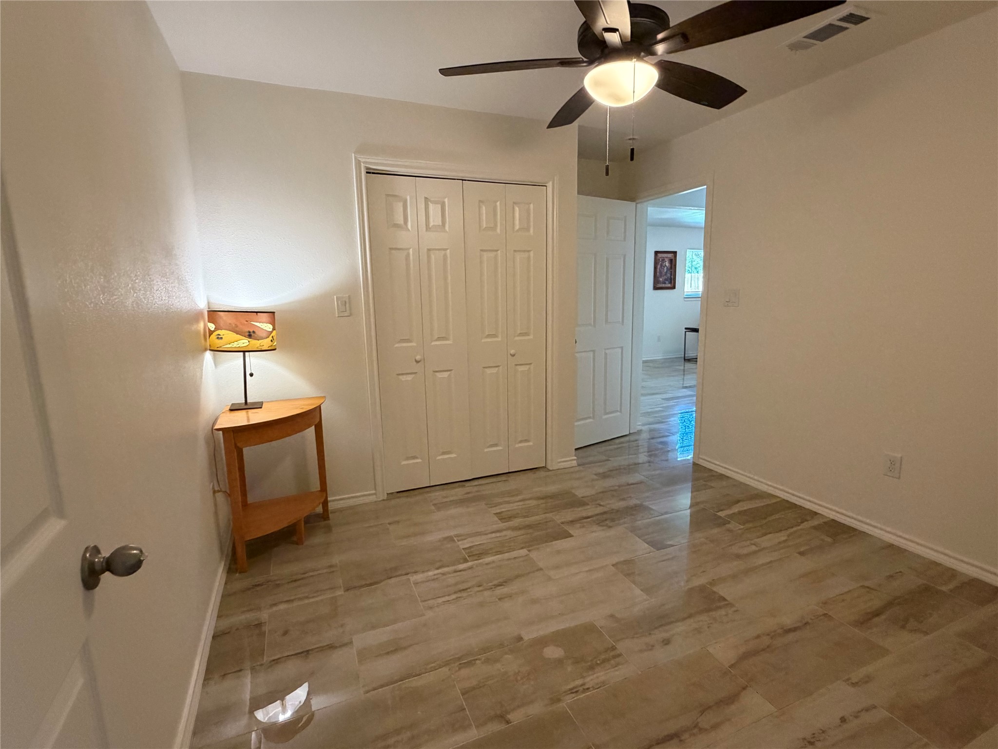 301 Sheraton Avenue Austin, TX 78745 - Photo 17 of 27 Cozy bedroom with gleaming floors and updated fixtures.