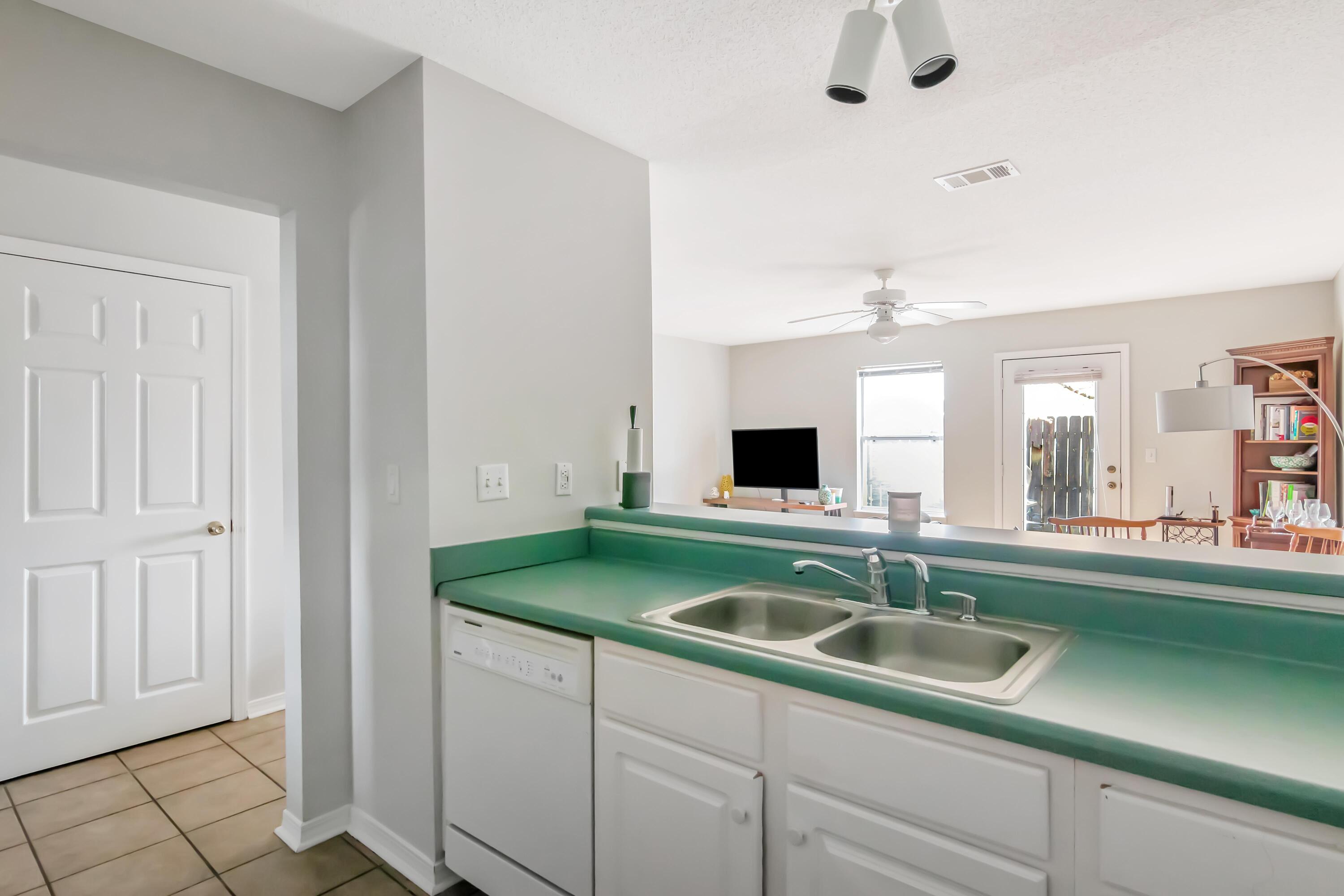 499 Keystone Road Mary Esther, FL 32569 - Photo 13 of 33 a kitchen with sink and window