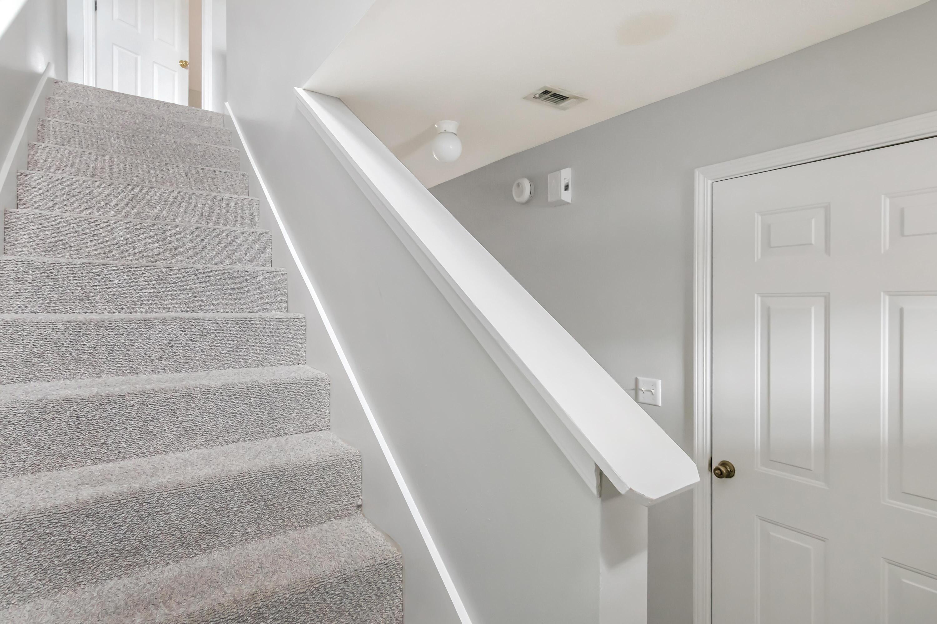 499 Keystone Road Mary Esther, FL 32569 - Photo 17 of 33 a view of staircase with white walls and white door