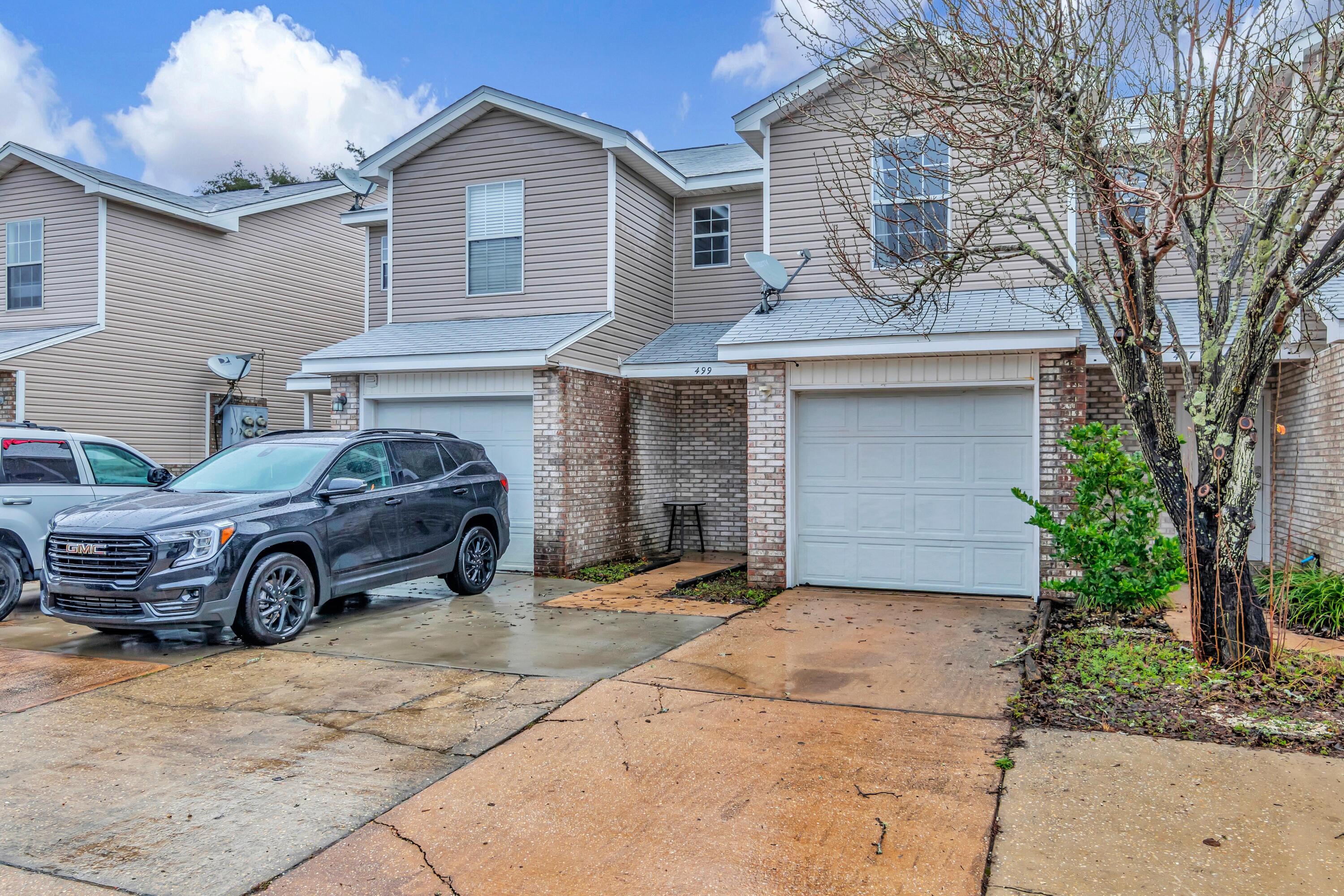 499 Keystone Road Mary Esther, FL 32569 - Photo 2 of 33 a front view of a house with parking space