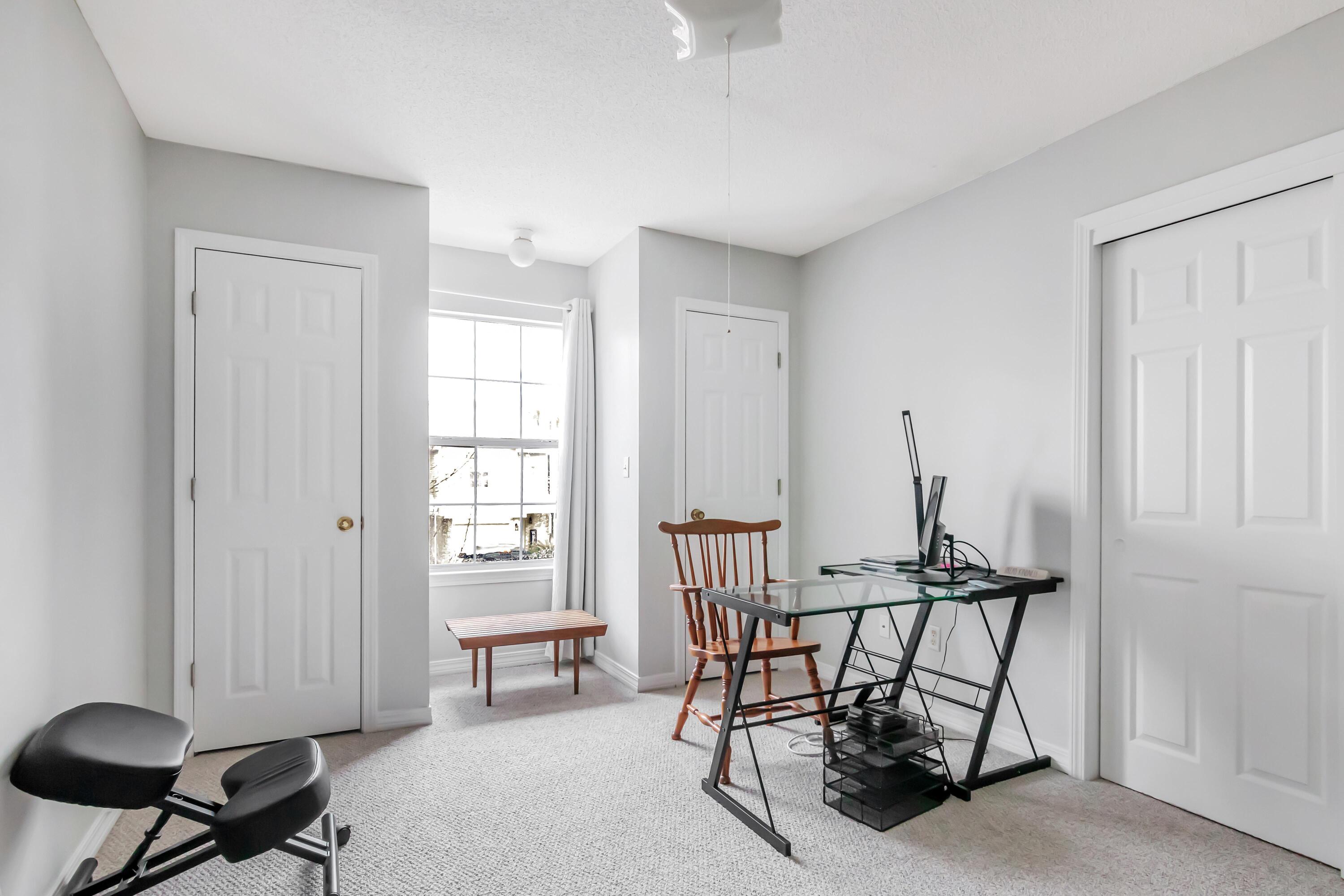 499 Keystone Road Mary Esther, FL 32569 - Photo 21 of 33 a view of a workspace with furniture and a window