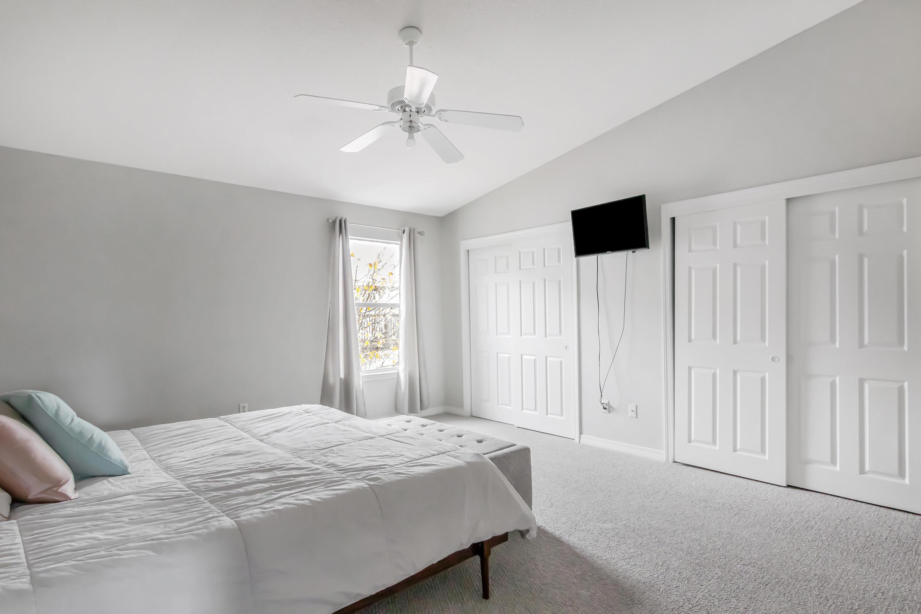 499 Keystone Road Mary Esther, FL 32569 - Photo 22 of 33 a bedroom with a large bed and a window