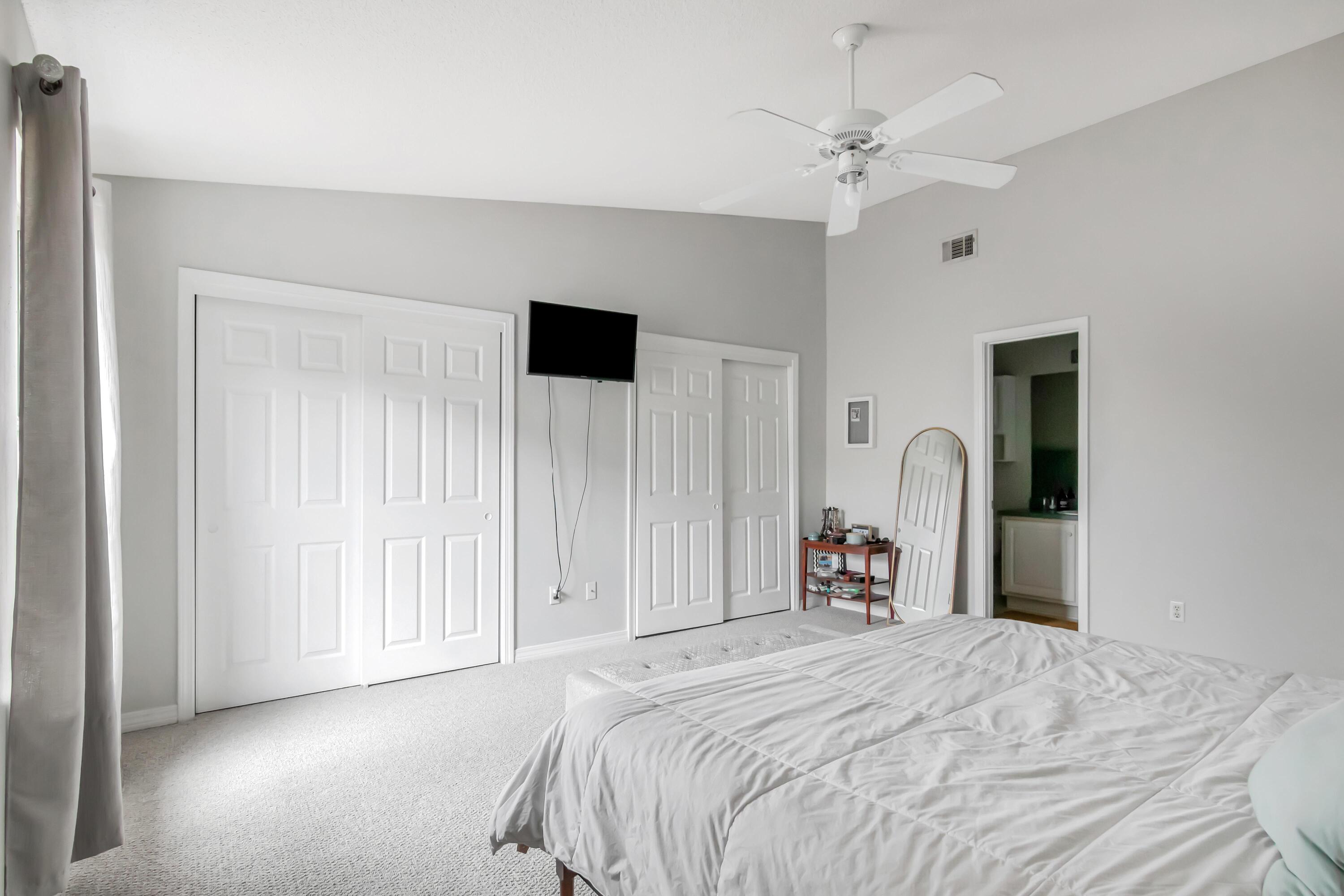 499 Keystone Road Mary Esther, FL 32569 - Photo 25 of 33 a bedroom with a bed and a chandelier