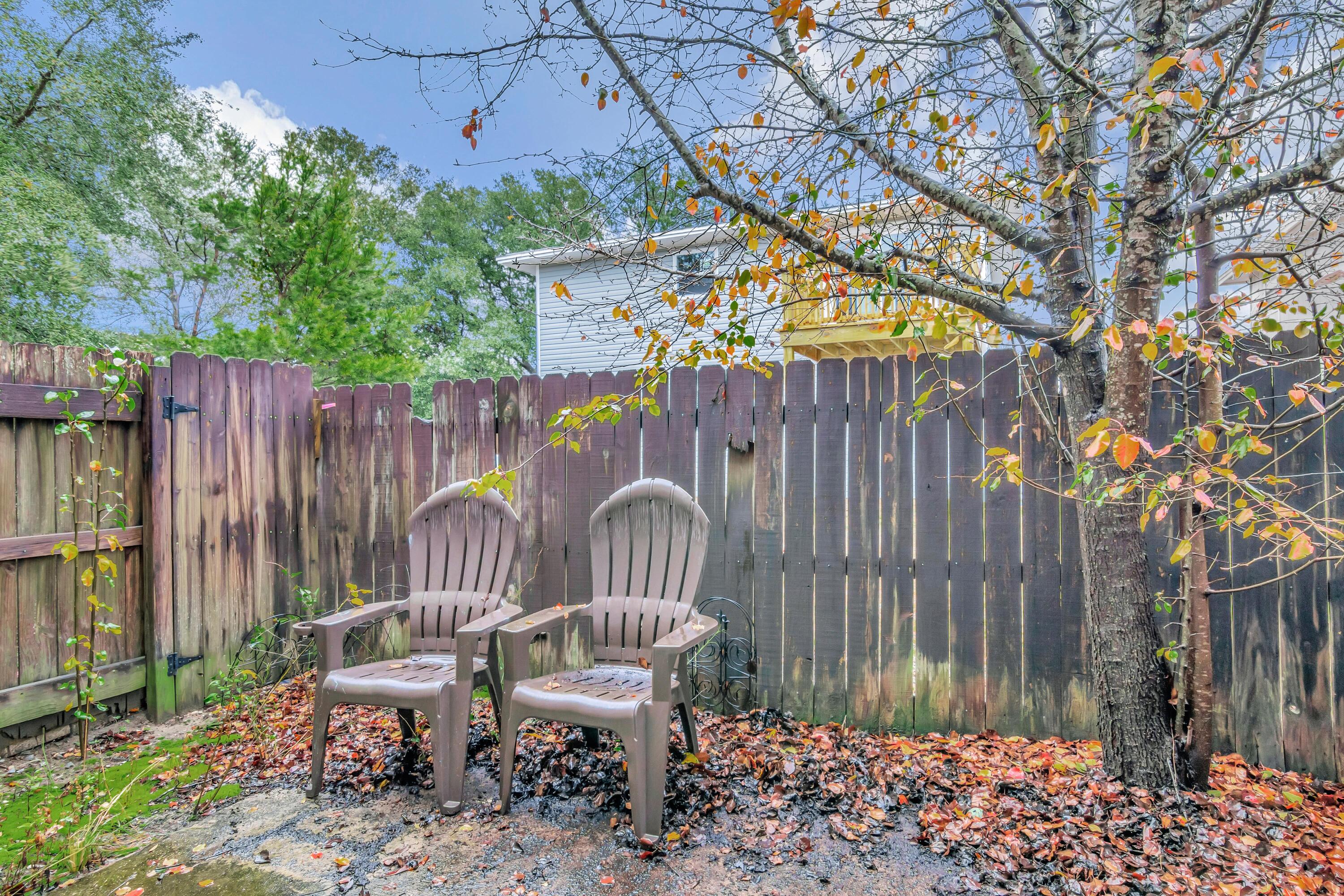 499 Keystone Road Mary Esther, FL 32569 - Photo 30 of 33 a view of outdoor space with seating area and wooden fence