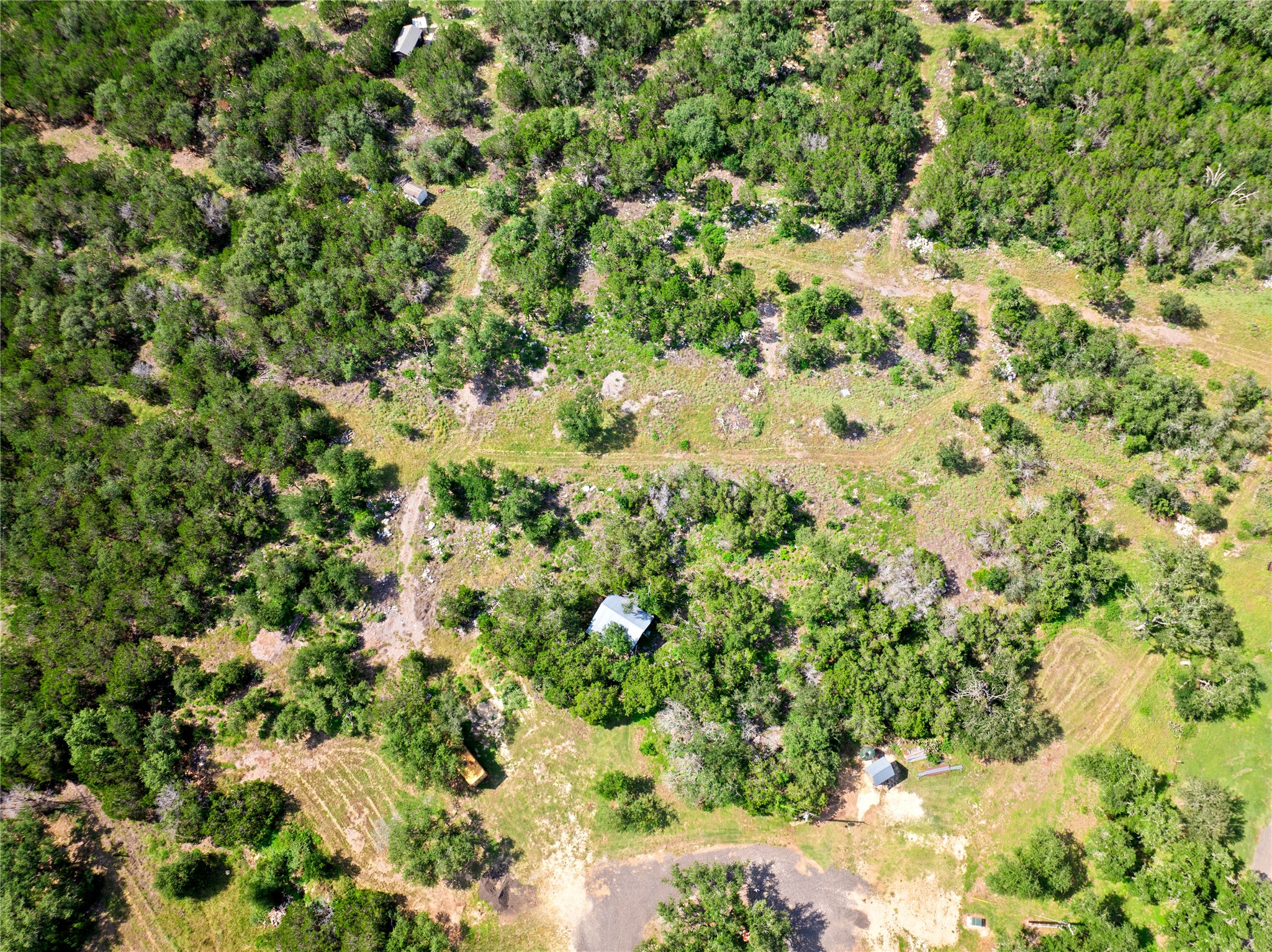 8200 Ranch Road 12 San Marcos, TX 78666 - Photo 25 of 40 A sprawling natural landscape with abundant tree cover offers secluded tranquility.