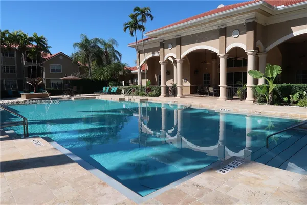 a view of a swimming pool with a patio