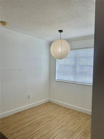 a kitchen with stainless steel appliances a refrigerator and cabinets