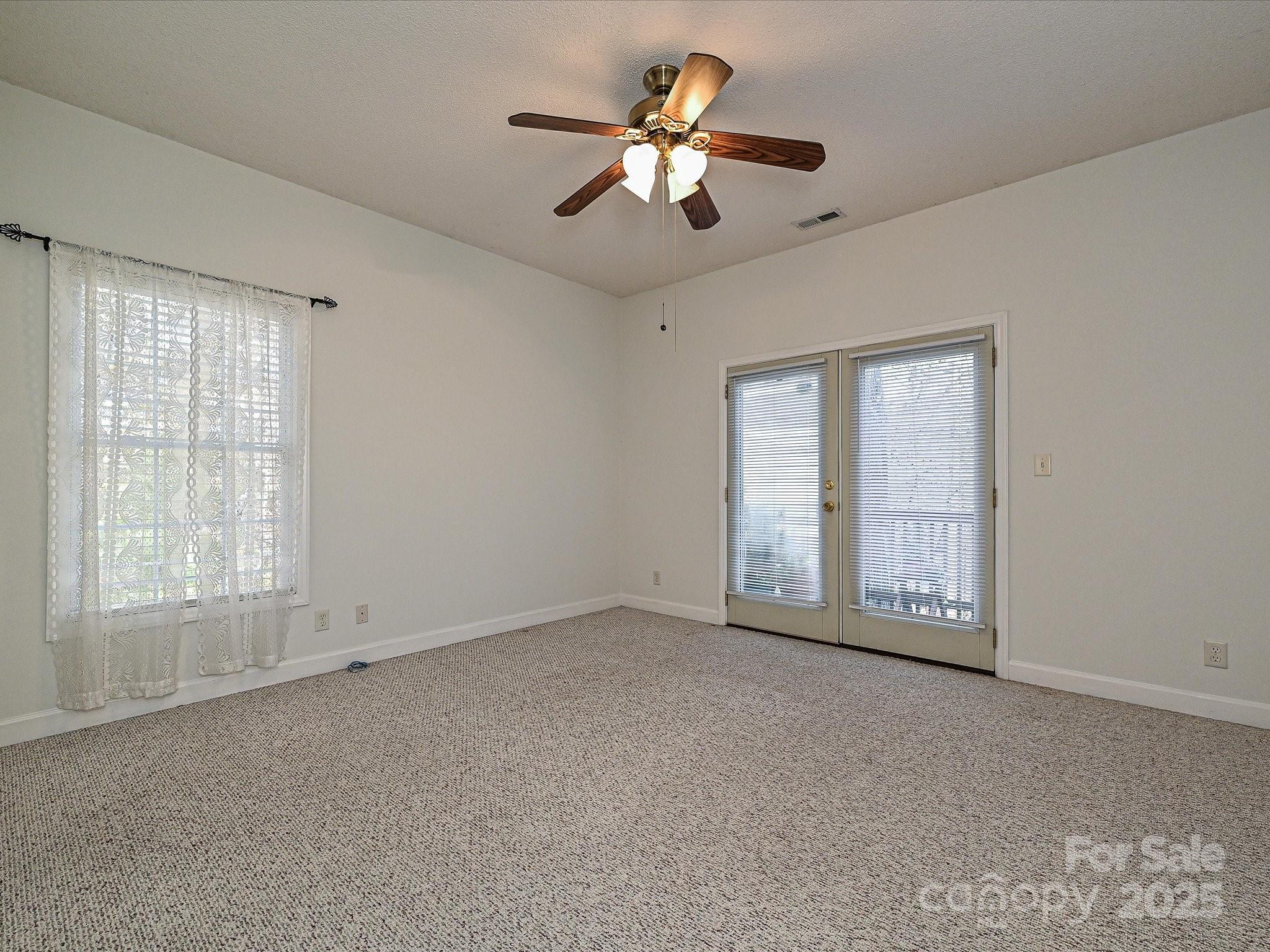 25040 Timberlake Drive Tega Cay, SC 29708 - Photo 27 of 40 a view of an empty room with a window