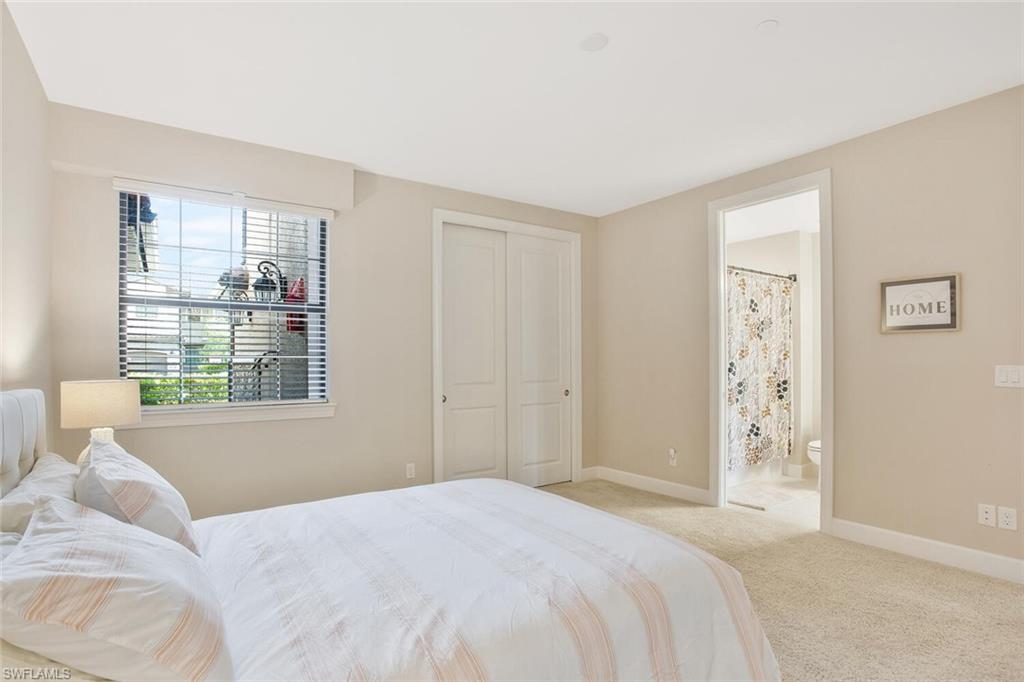 9650 Montelanico Loop, Unit 103 Naples, FL 34119 - Photo 15 of 29 a bedroom with a bed and a window