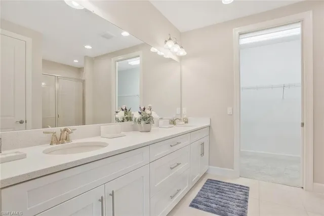 a bathroom with a glass shower door