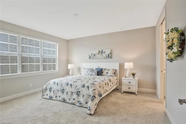 a living room with furniture and a dining table with wooden floor