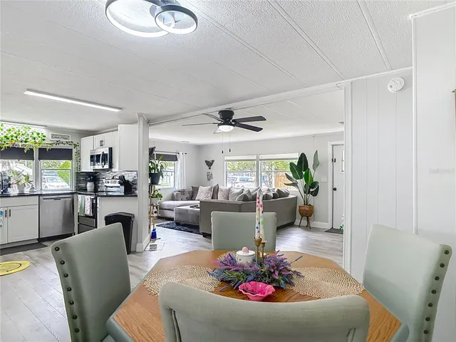 a kitchen with stainless steel appliances a stove a sink and a microwave