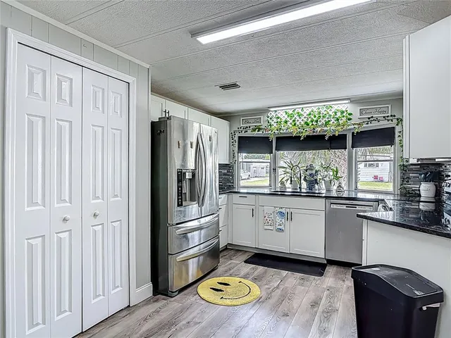 a kitchen with stainless steel appliances a stove and a refrigerator