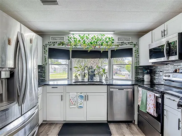 a view of livingroom with hardwood floor and a ceiling fan