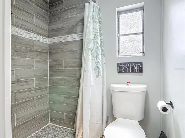 a kitchen with sink and refrigerator